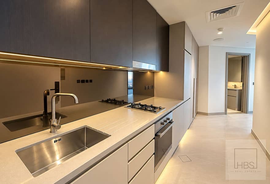 3 Modern Galley Kitchen with Warm Lighting. png