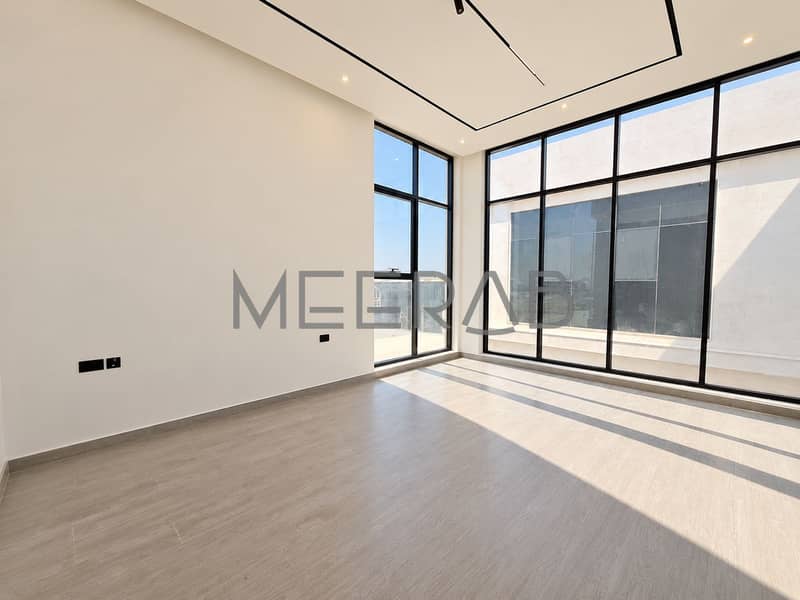9 Sunlit Minimalist Room with Floor-to-Ceiling Windows. png