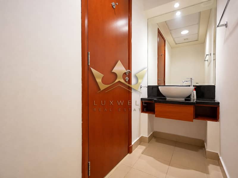 8 Modern Vanity Corridor with Warm Wood Door. png