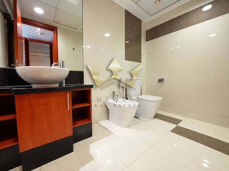 10 Modern Bathroom with Warm Wood Vanity. png