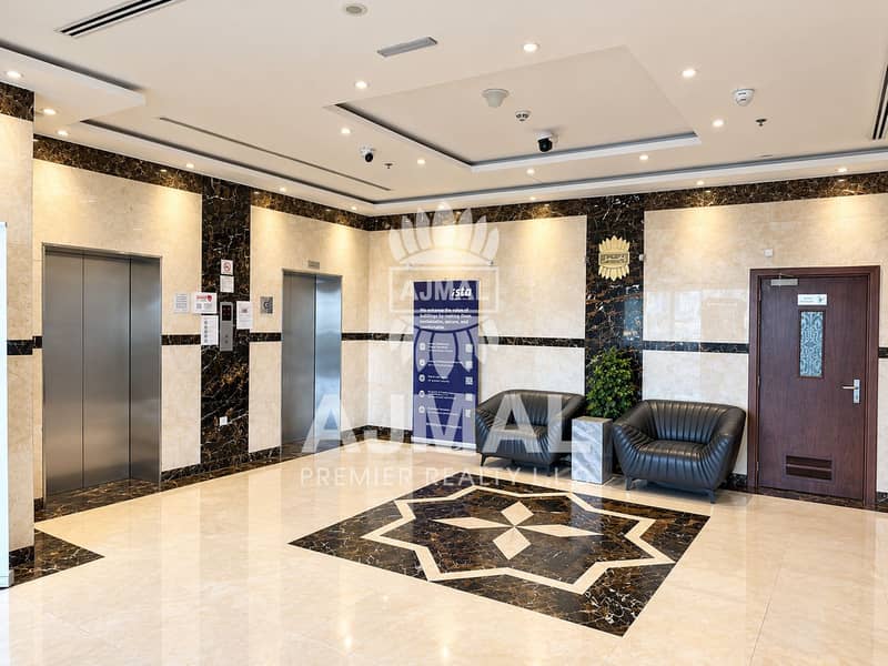 11 Elegant Marble Lobby with Elevators and Seating. png