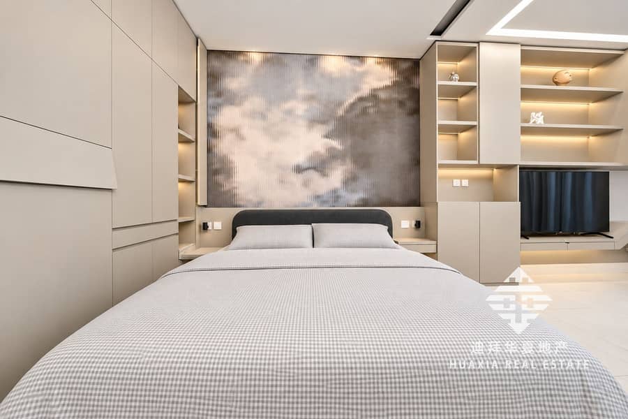 4 Minimalist Taupe Bedroom with Integrated TV Wall. png