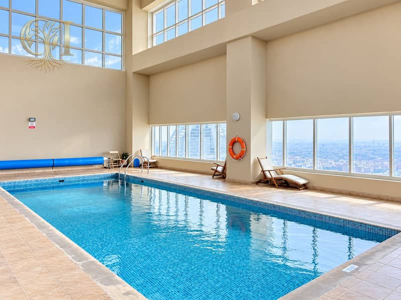 10 Sunlit Luxury Indoor Pool with City Views. png
