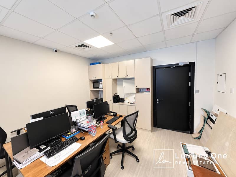 2 Modern Office Workspace with Monitors and Sample Boards. png
