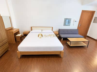 Studio te Huur in Jumeirah Village Circle (JVC), Dubai - Minimalist Wood-Furnished Bedroom. png Studio te Huur in Jumeirah Village Circle (JVC), Dubai - Minimalist Wood-Furnished Bedroom. png