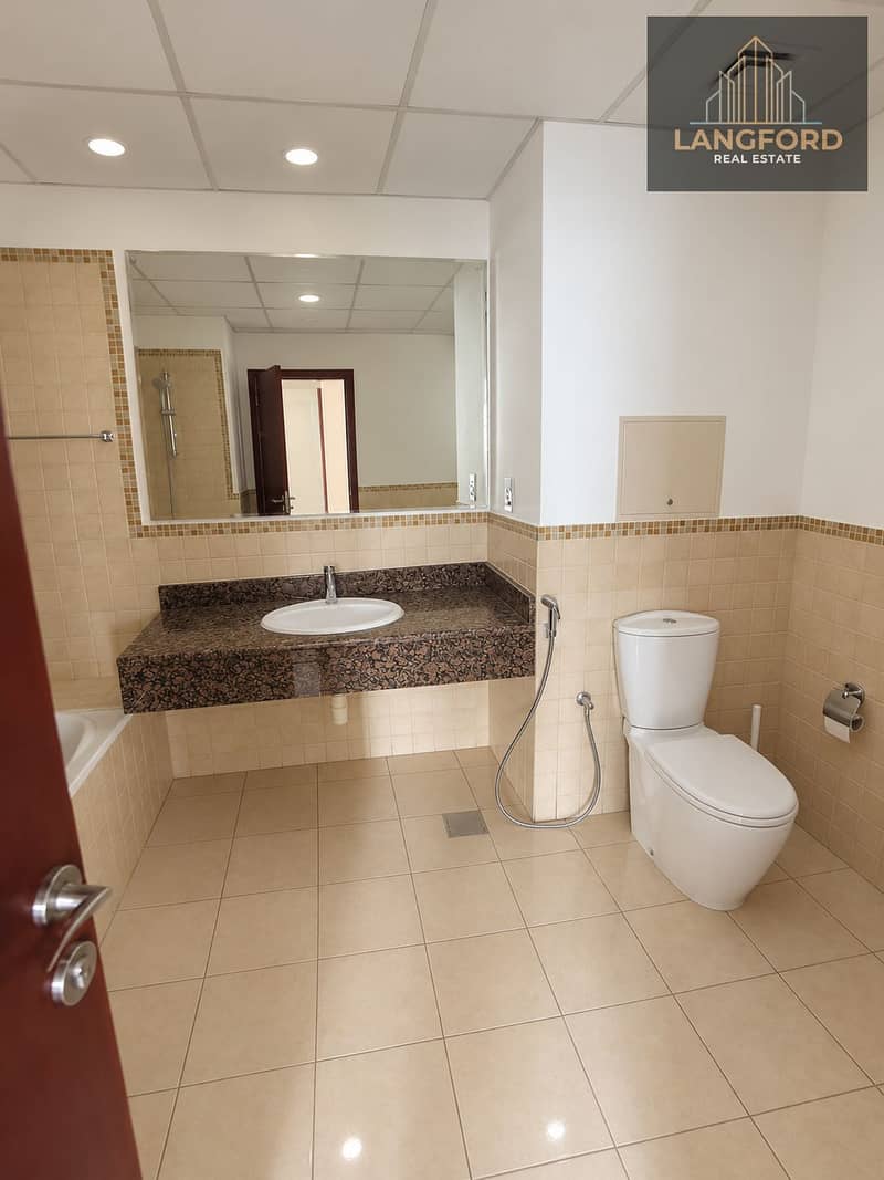17 Modern Beige-Tiled Bathroom Interior. png