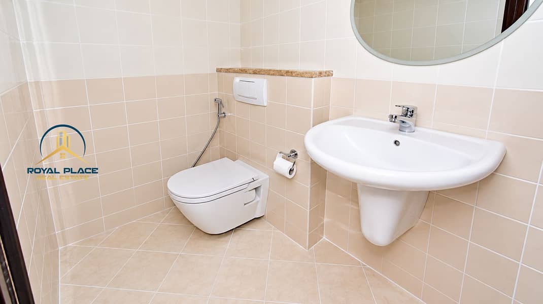 8 Bright Modern Beige-Tiled Bathroom. png