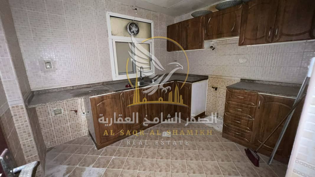 13 غرفة-وصالة-للا-يجار-2-غرف-البوطينة-الشارقة-صورة-العقار-yt-001-01. jpg