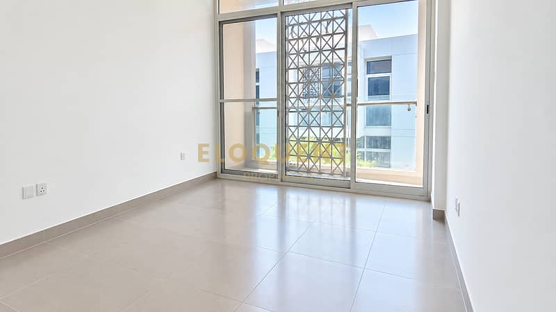 2 Bright Minimalist Room with Balcony Views. png