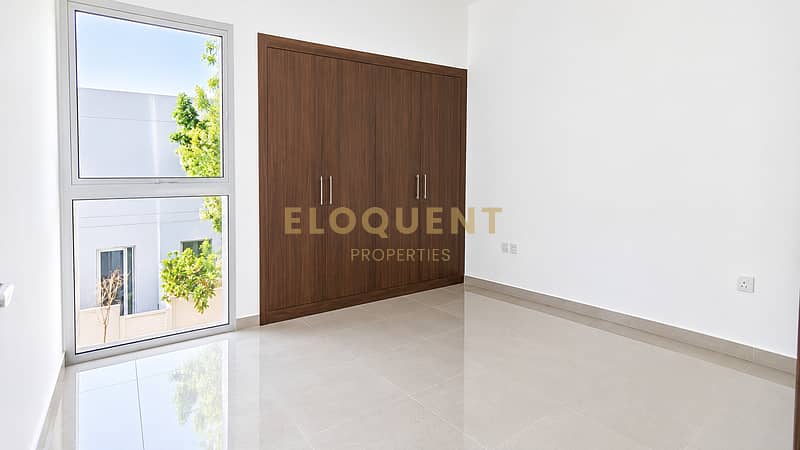 3 Sunlit Minimalist Room with Walnut Wardrobe. png