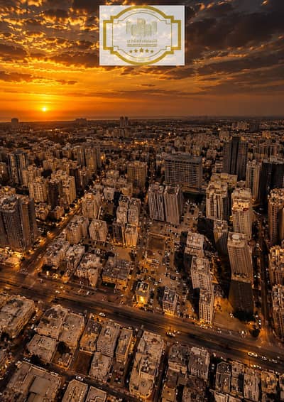 ارض استخدام متعدد للبيع في النعيمية، عجمان - Golden Hour Over the Urban Grid. png ارض استخدام متعدد للبيع في النعيمية، عجمان - Golden Hour Over the Urban Grid. png