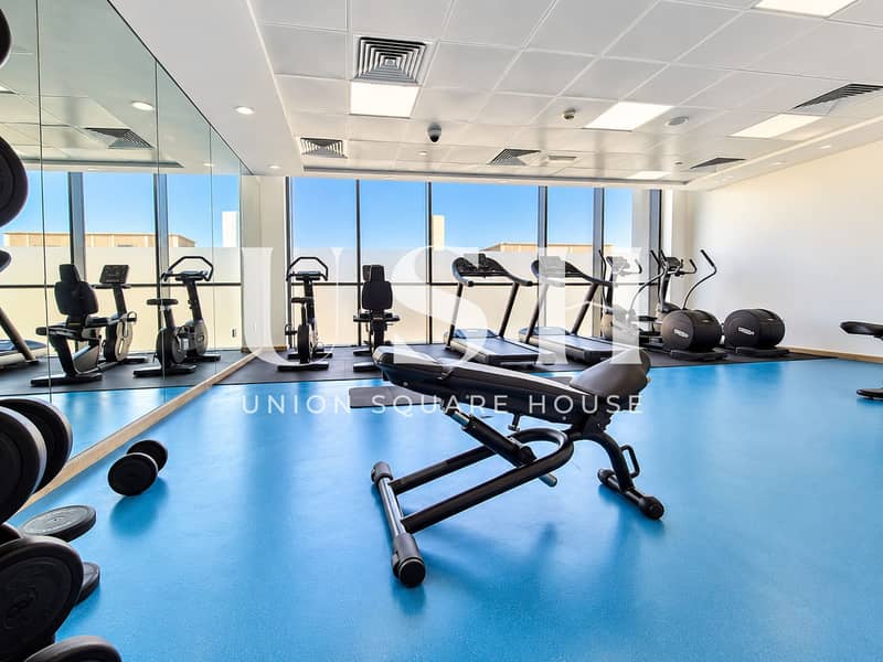 16 Sunlit Modern Gym with Cardio Equipment. png