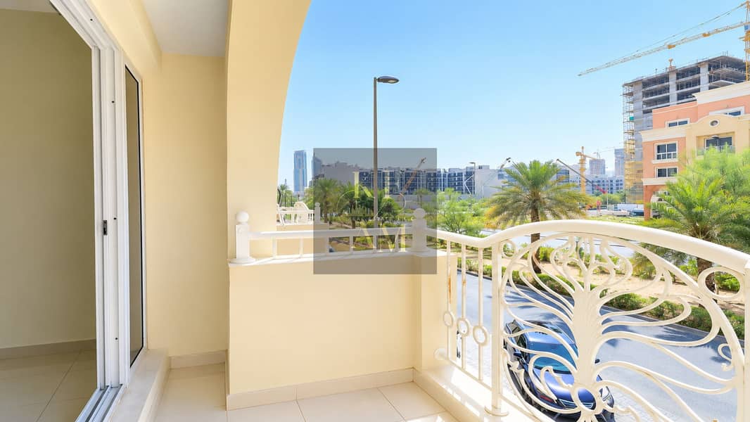 19 Sunlit Balcony Overlooking Urban Gardens. png