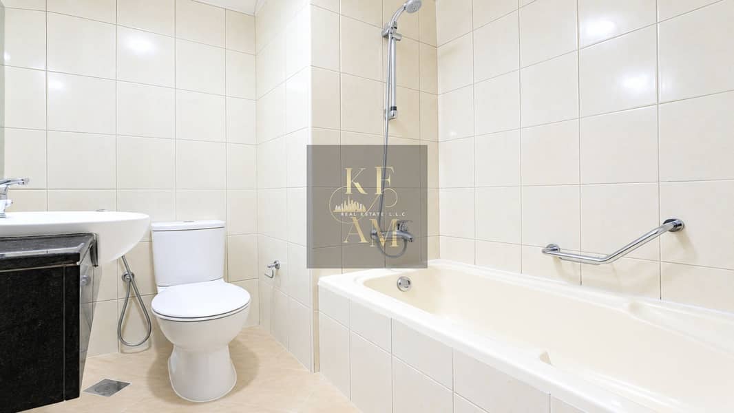 22 Bright Modern Cream-Tiled Bathroom. png