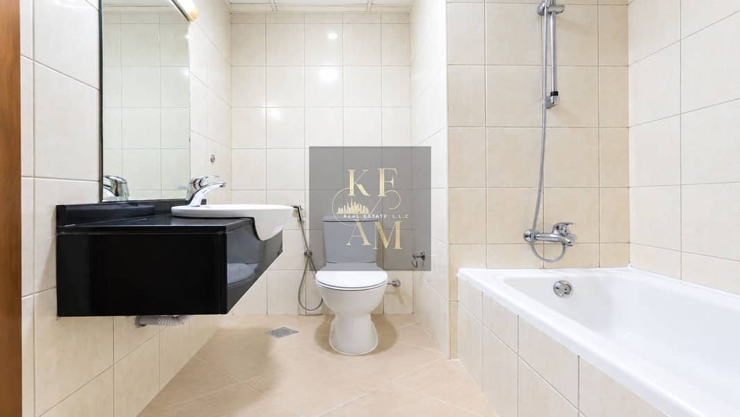 23 Modern Beige Tiled Bathroom. png