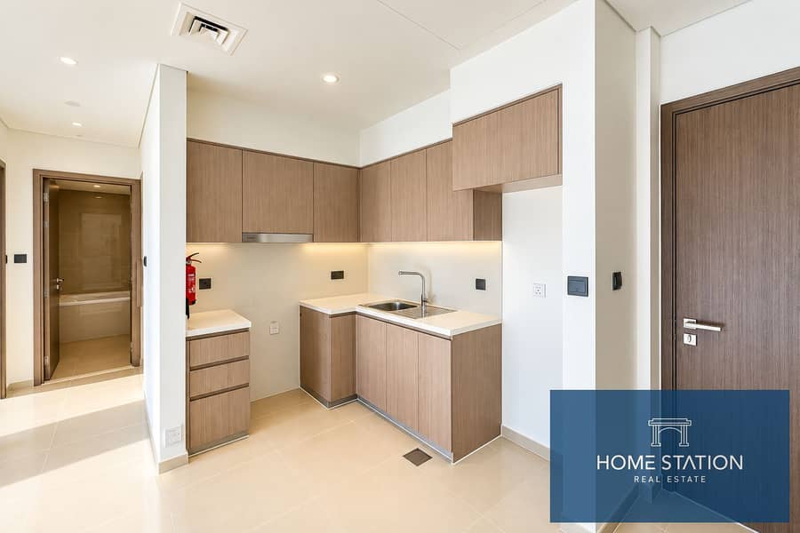6 Modern Warm-Toned Apartment Kitchen. png