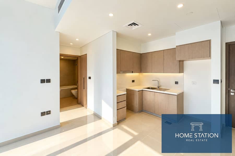 9 Sunlit Minimalist Apartment Kitchenette. png