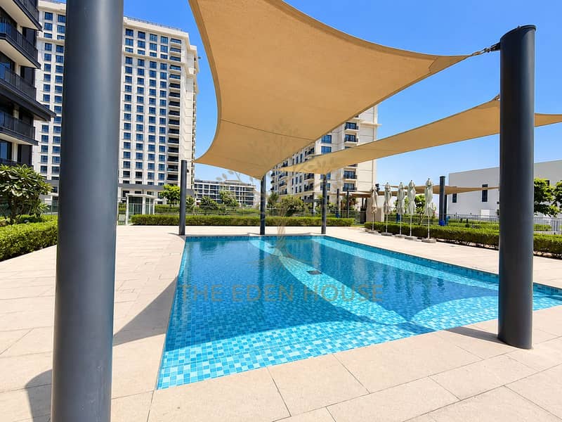 39 Luxury Apartment Pool Under Sun Sails. png