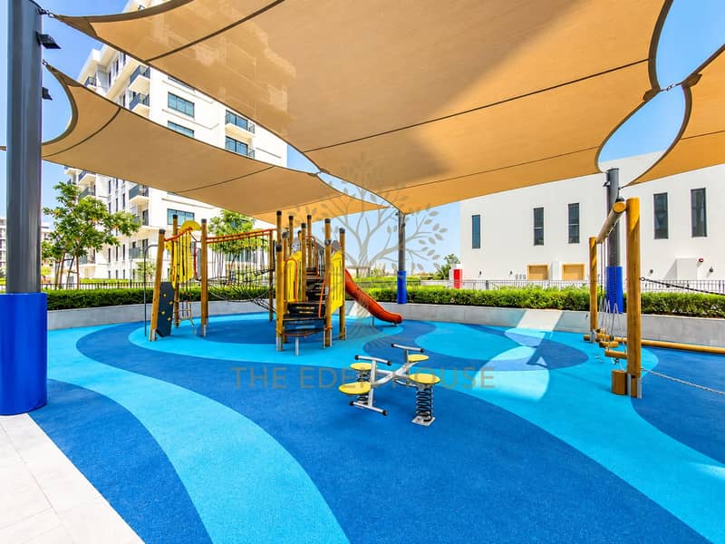 40 Sunlit Modern Playground Under Sails. png