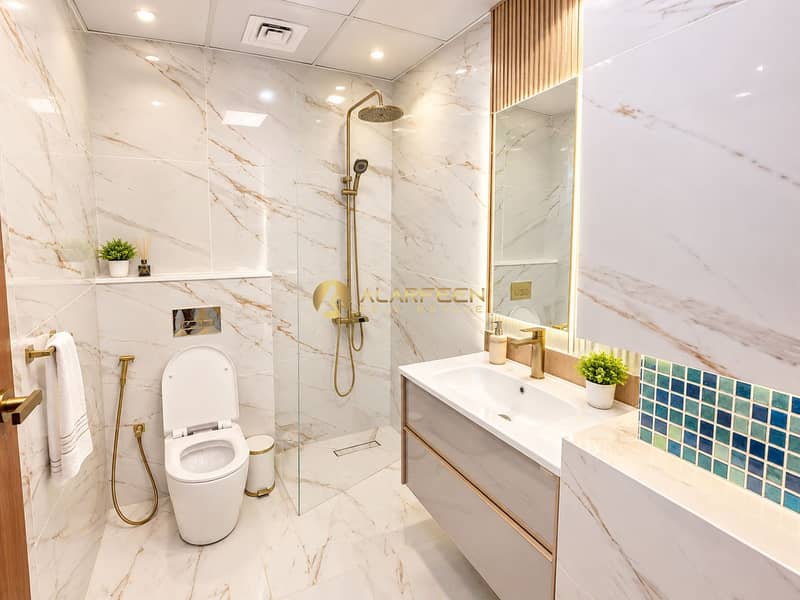 6 Luxurious Marble Bathroom with Brass Accents. png
