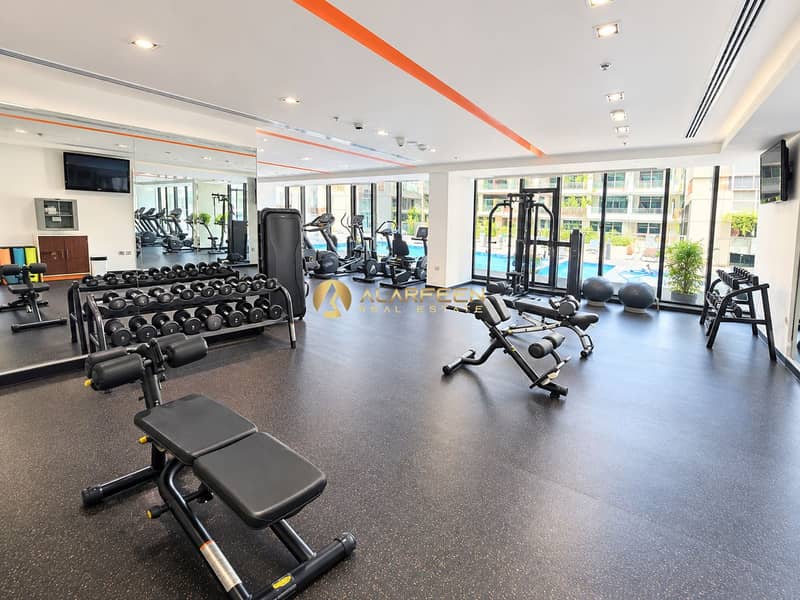 7 Modern Condo Gym with Pool Views. png