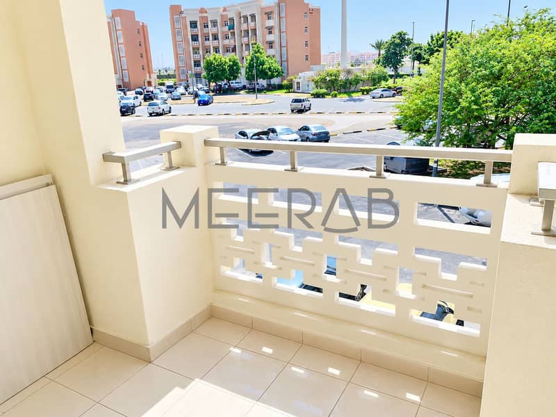 11 Sunlit Balcony Overlooking Residential Complex. png