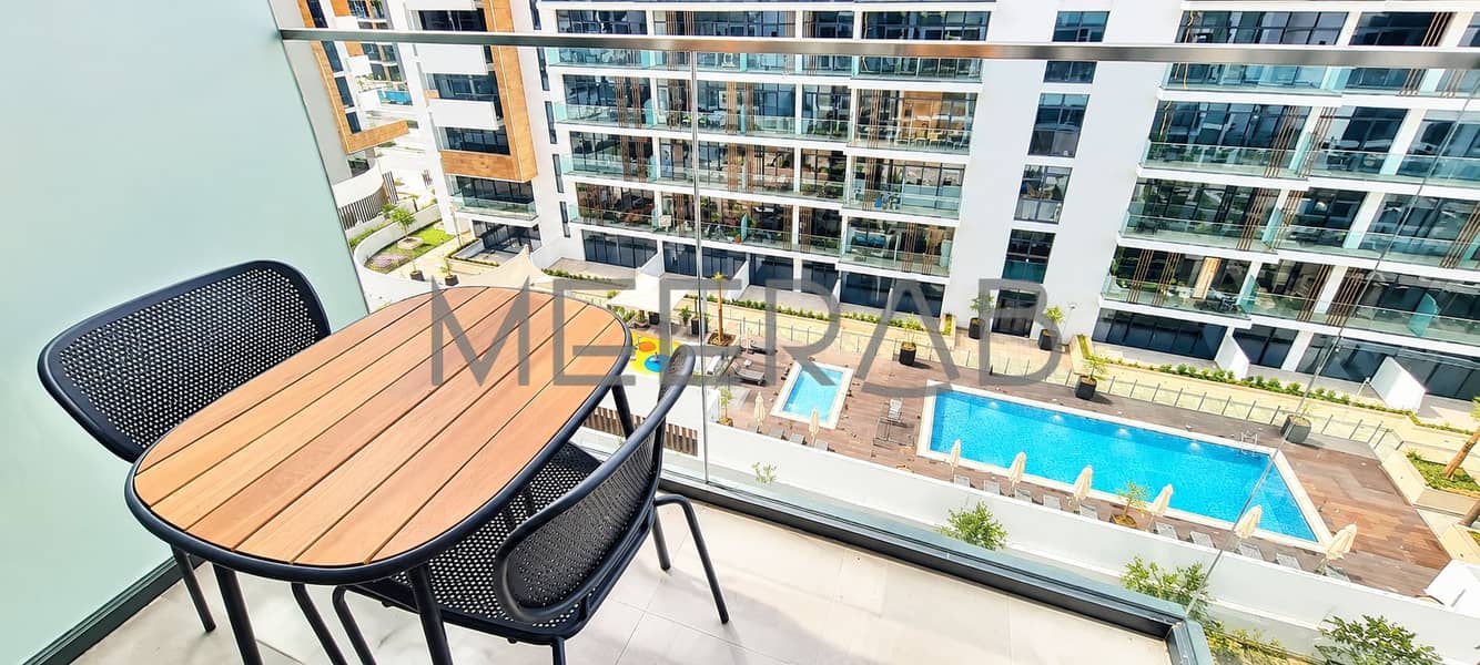 7 Balcony Overlooking a Modern Pool Courtyard. png