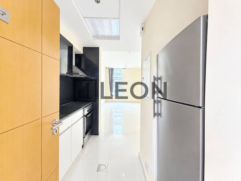 5 Modern Galley Kitchen with City View. png