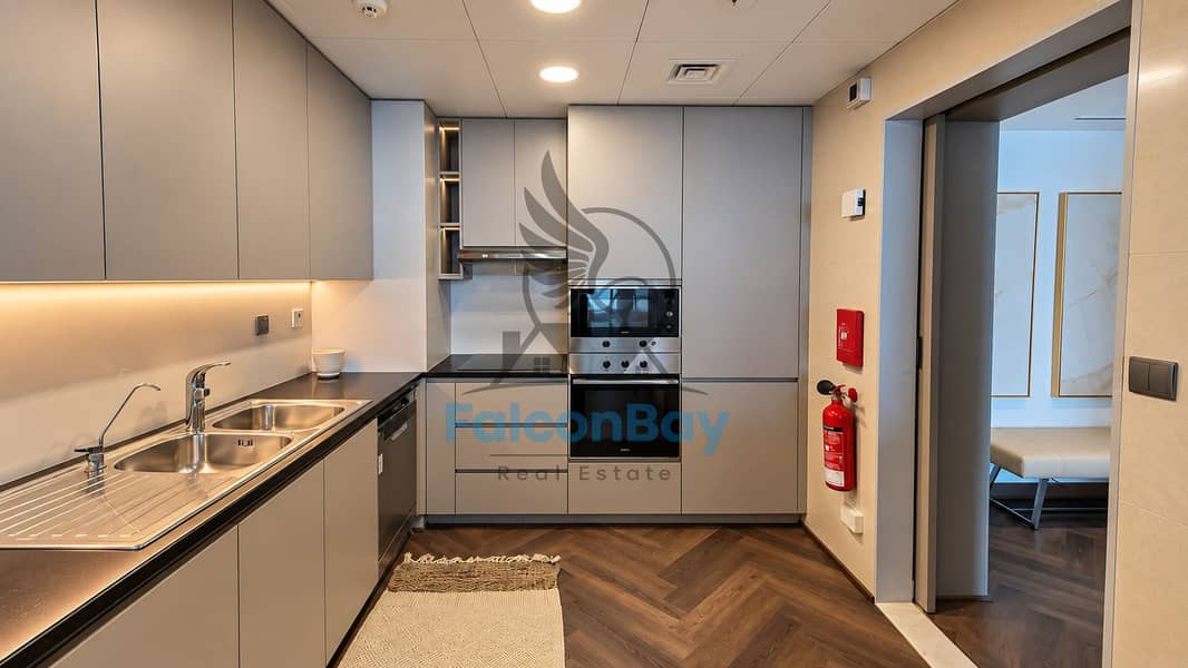 15 Modern Taupe Kitchen with Herringbone Flooring. png