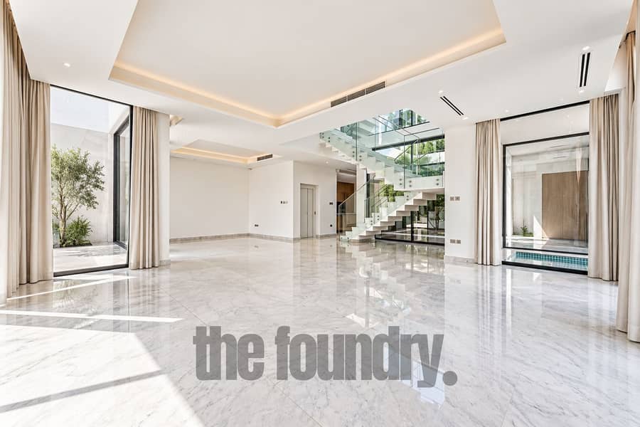 2 Minimalist Luxury Atrium with Floating Staircase. png