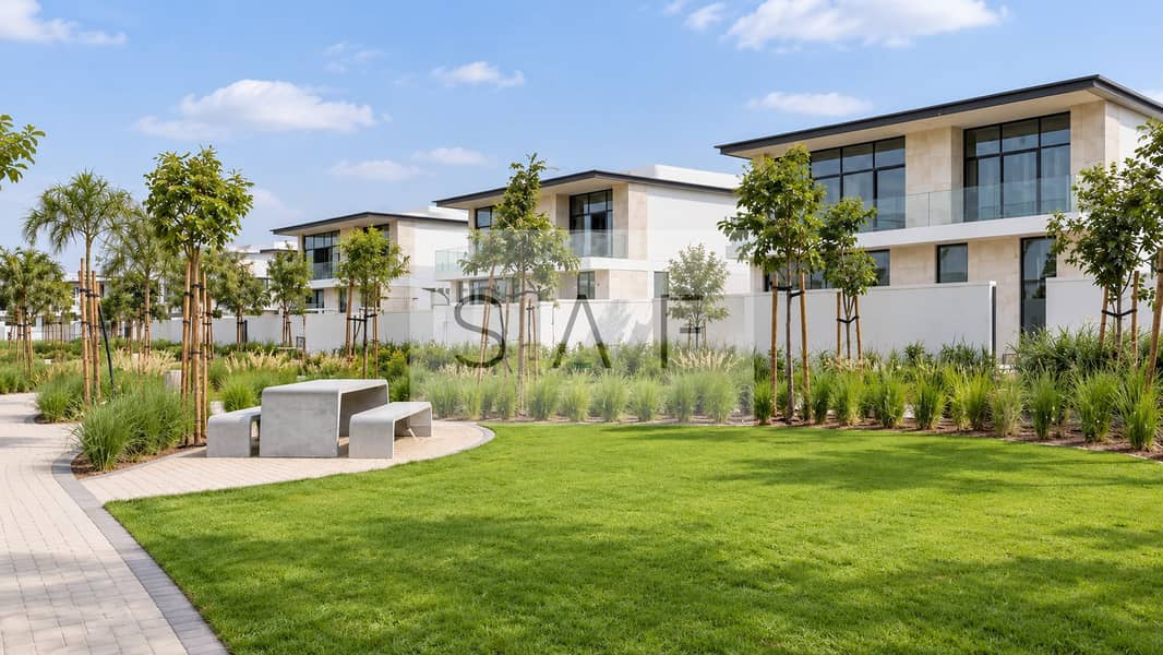 2 Bright community lawn beside modern villas. png