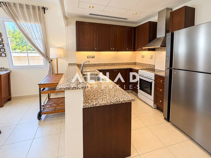 6 Warm Modern Kitchen with Breakfast Bar. png
