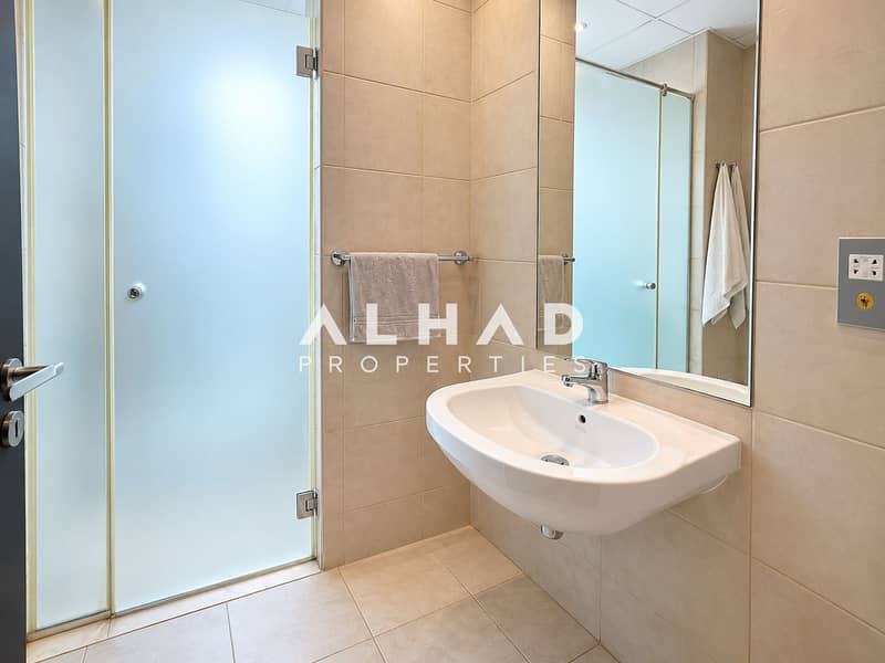 11 Minimalist Beige Tile Bathroom. png