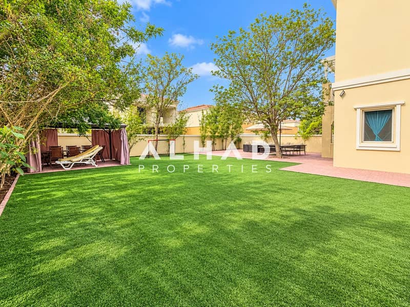 15 Sunny Suburban Backyard with Pergola and Turf. png