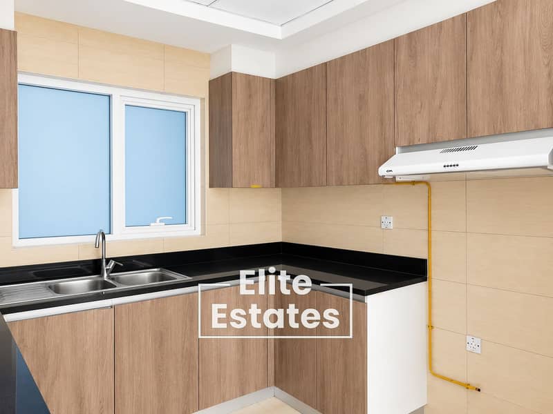 11 Minimal L-Shaped Oak Kitchen. png