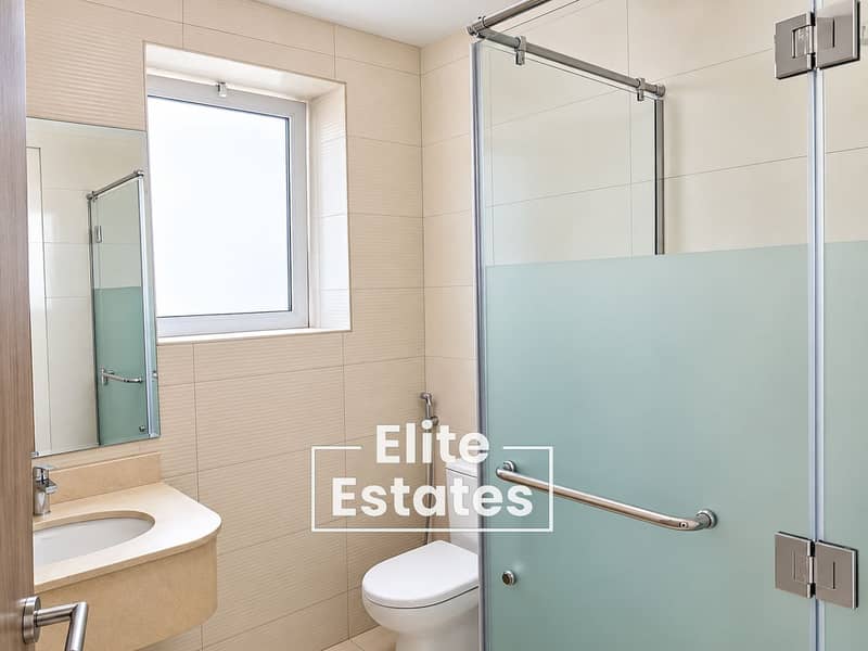 15 Modern Beige Bathroom with Frosted Shower Glass. png