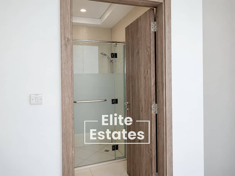 18 Modern Wood-Framed Shower Entrance. png