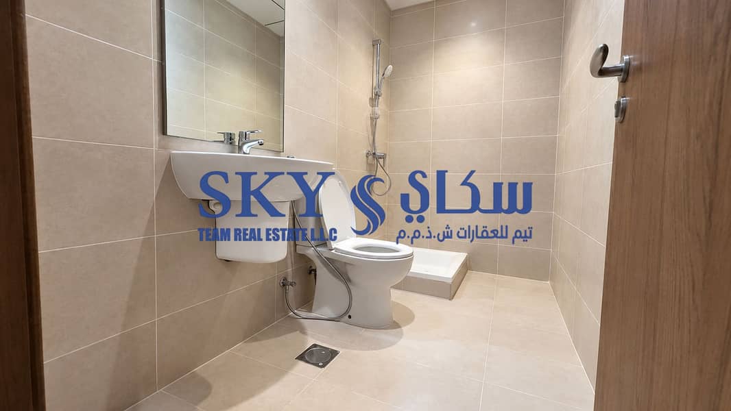 6 Modern Beige-Tiled Bathroom Interior. png