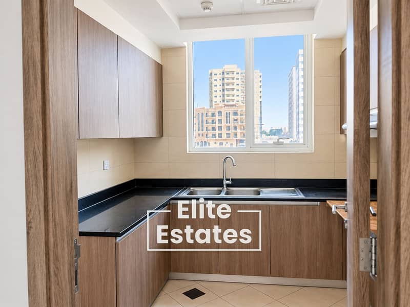 10 Bright Minimalist Kitchen with City View. png