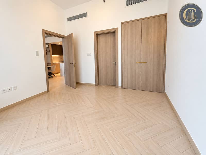 6 Modern Empty Bedroom with Warm Kitchen View. png