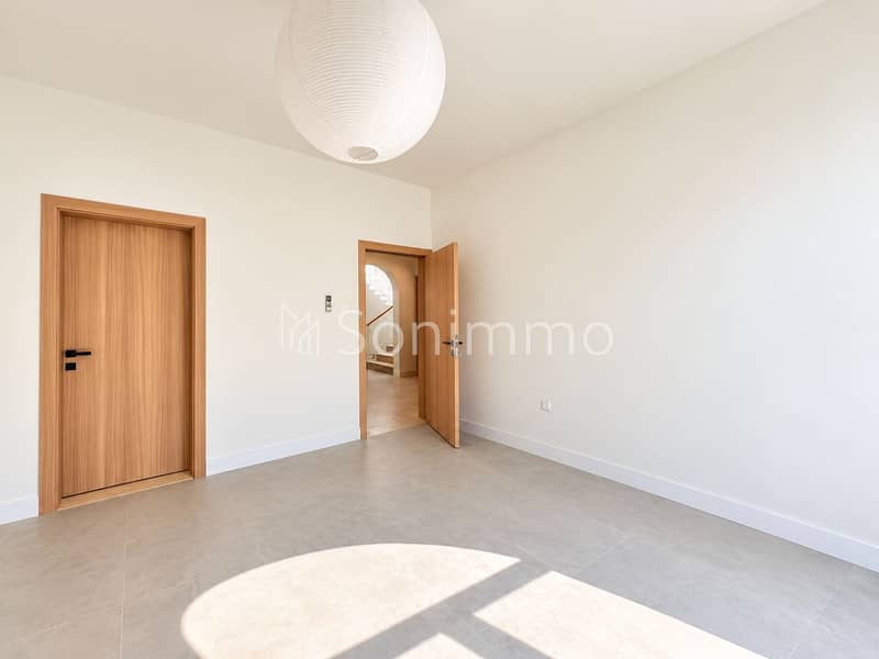 8 Minimalist Room with Lantern and Open Door. png