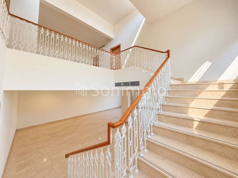 6 Sunlit Marble Foyer with Ornate Staircase. png