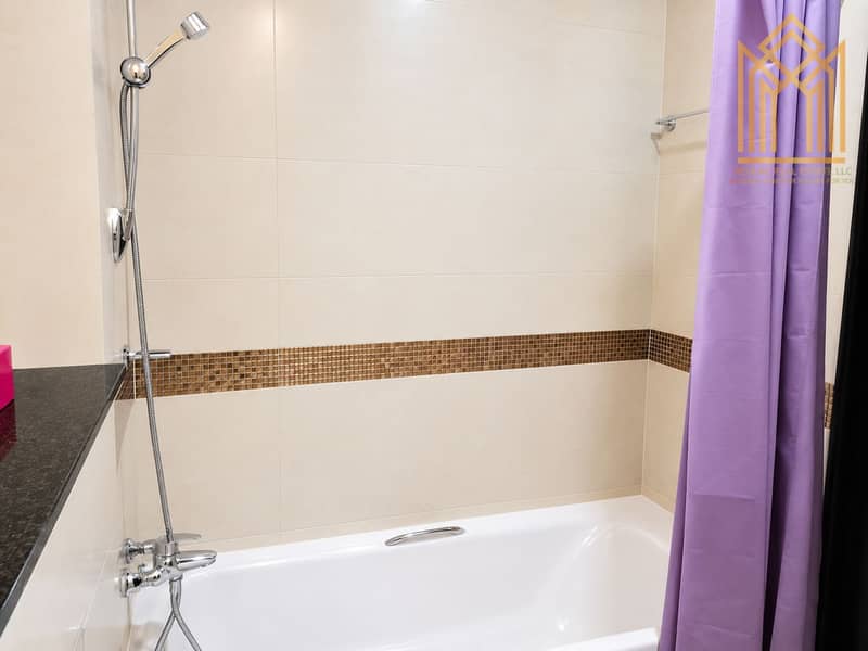 6 Modern Beige Tile Bathroom with Purple Curtain (1). png
