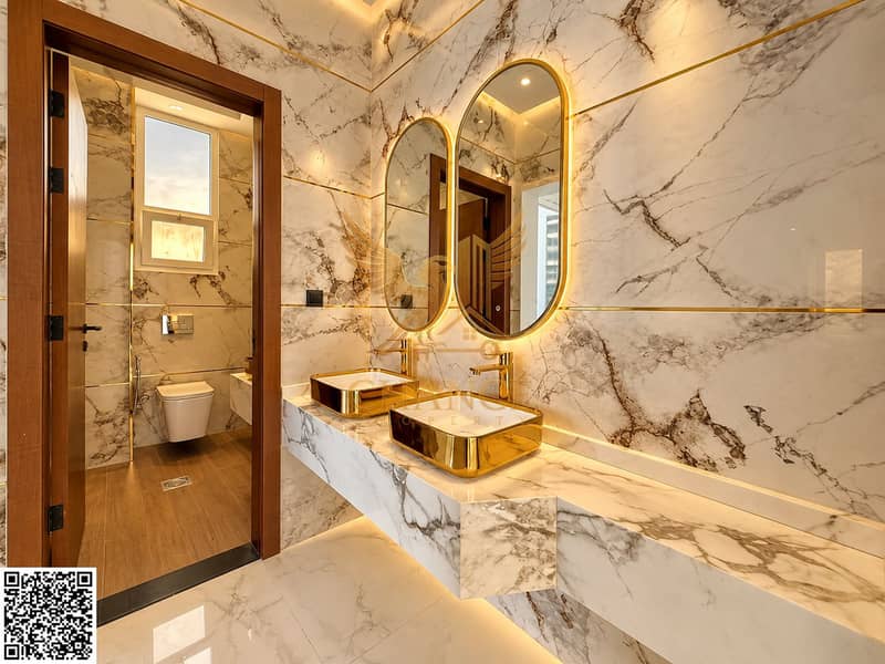 10 Luxe Marble Bathroom with Gold Accents. png