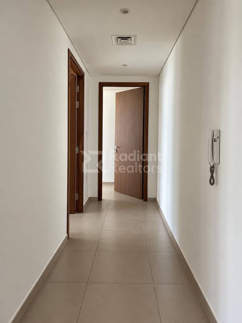 8 Bright Modern Hallway with Open Door. jpg