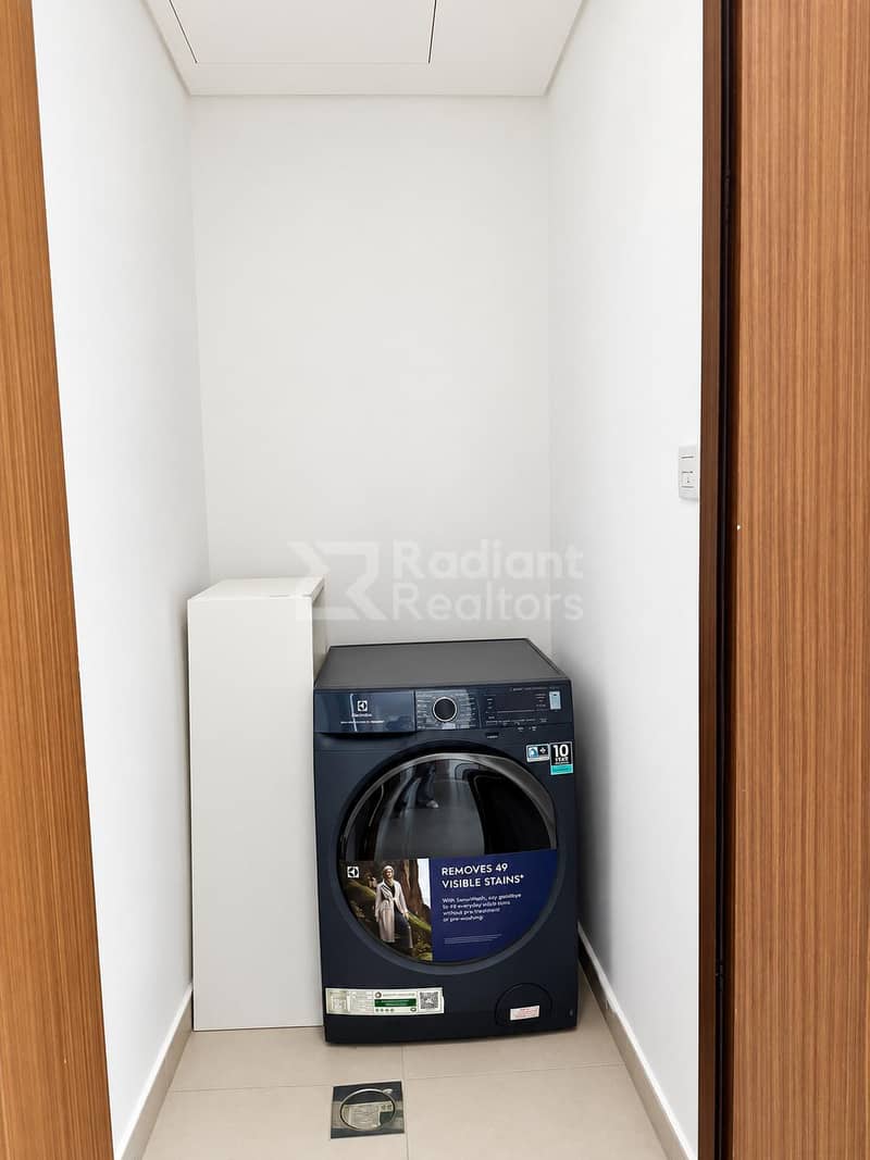 13 Minimal Laundry Alcove with Electrolux Washer. jpg