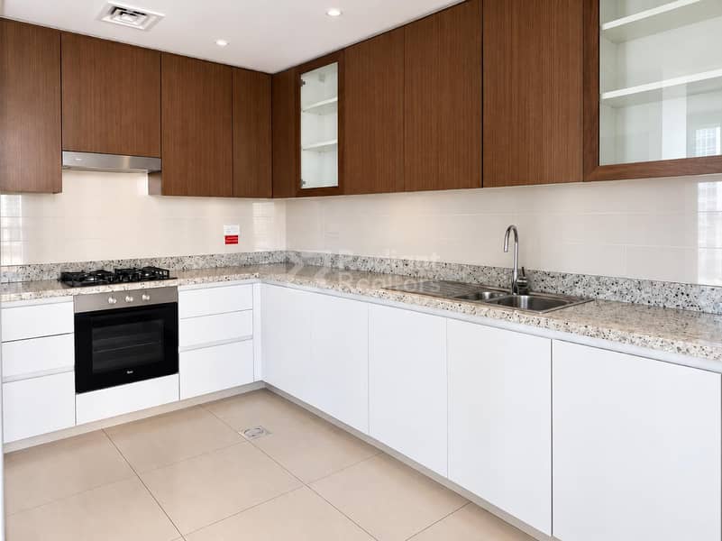 14 Modern Walnut-Tone Minimalist Kitchen. jpg