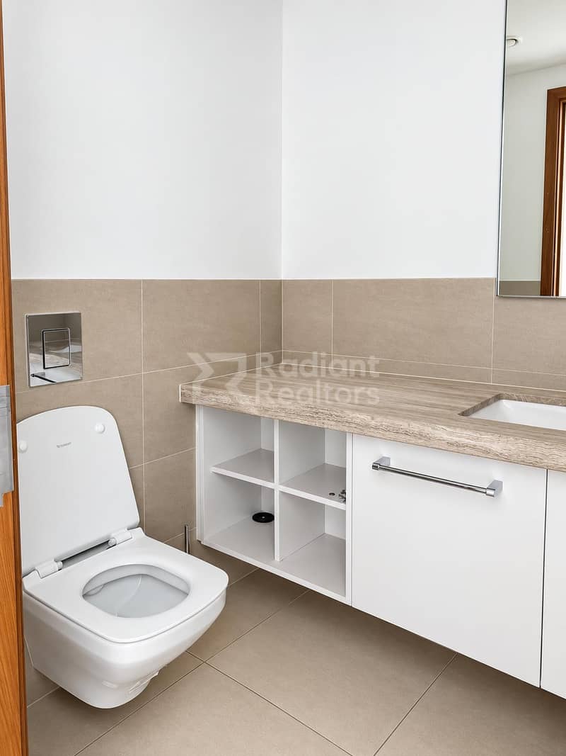 17 Minimalist Beige-Tiled Powder Room. jpg