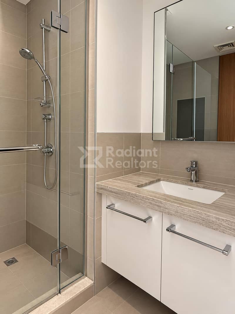 19 Modern Taupe Bathroom with Glass Shower. jpg