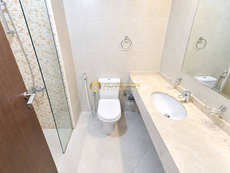 6 Bright Modern Beige-Tiled Bathroom. png